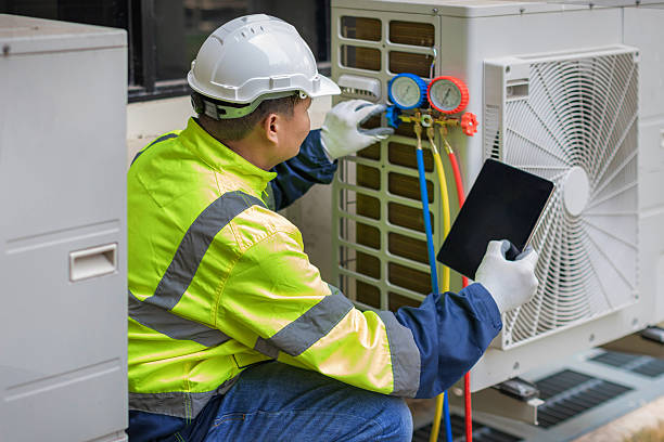 Professional Heat Pump Repair technician working in Dover, NH